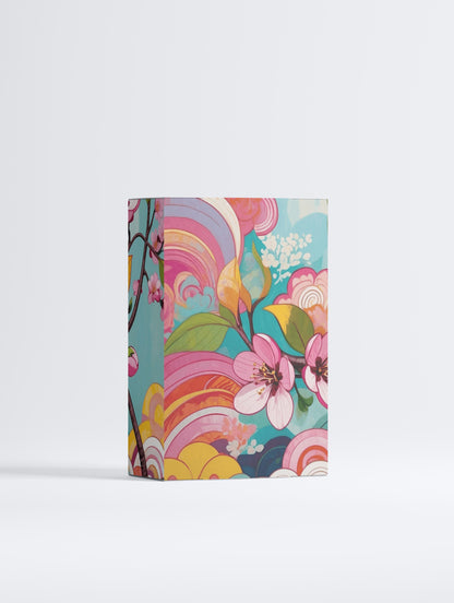 Colorful floral and abstract design notebook on a white background