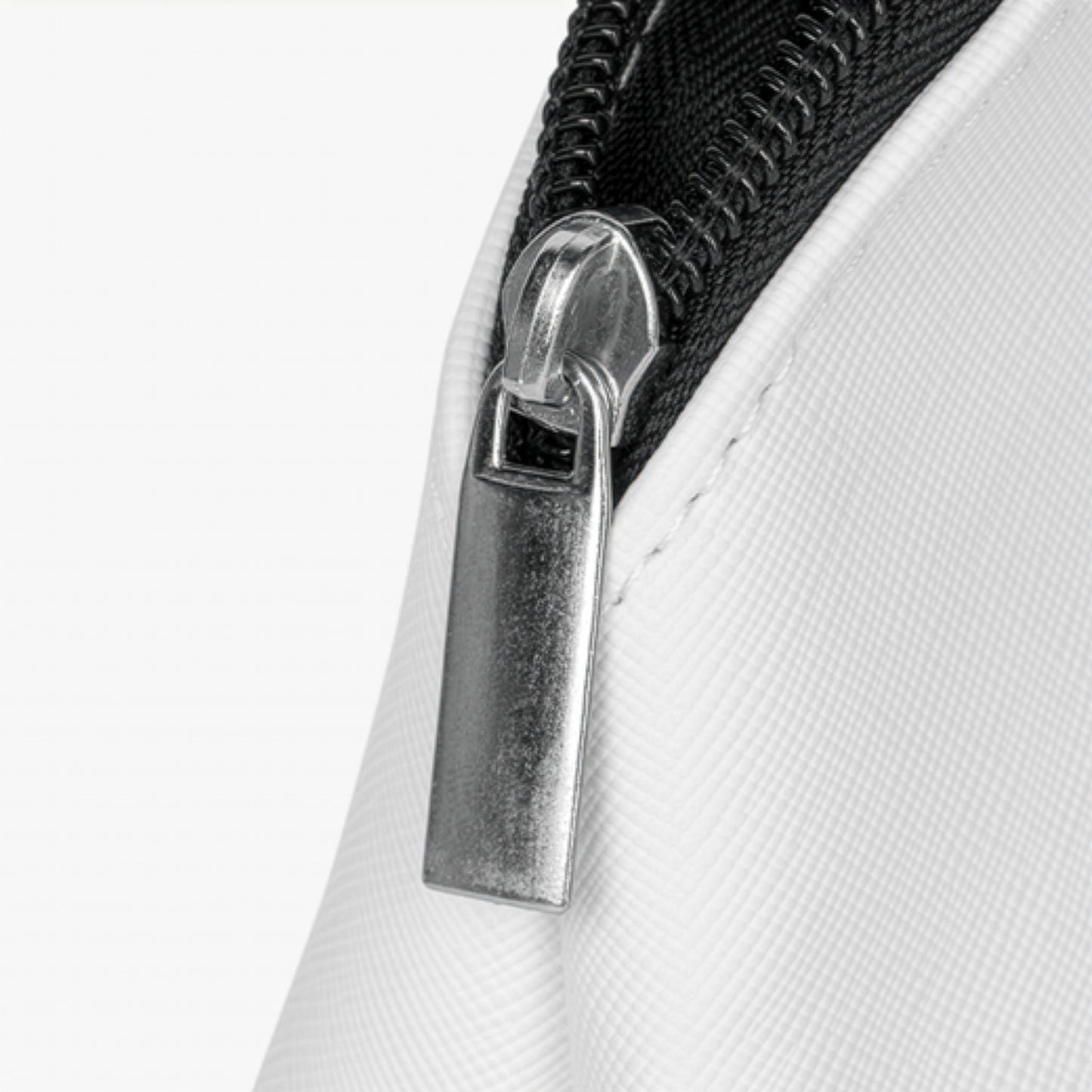 Close-up of a zipper on a white background