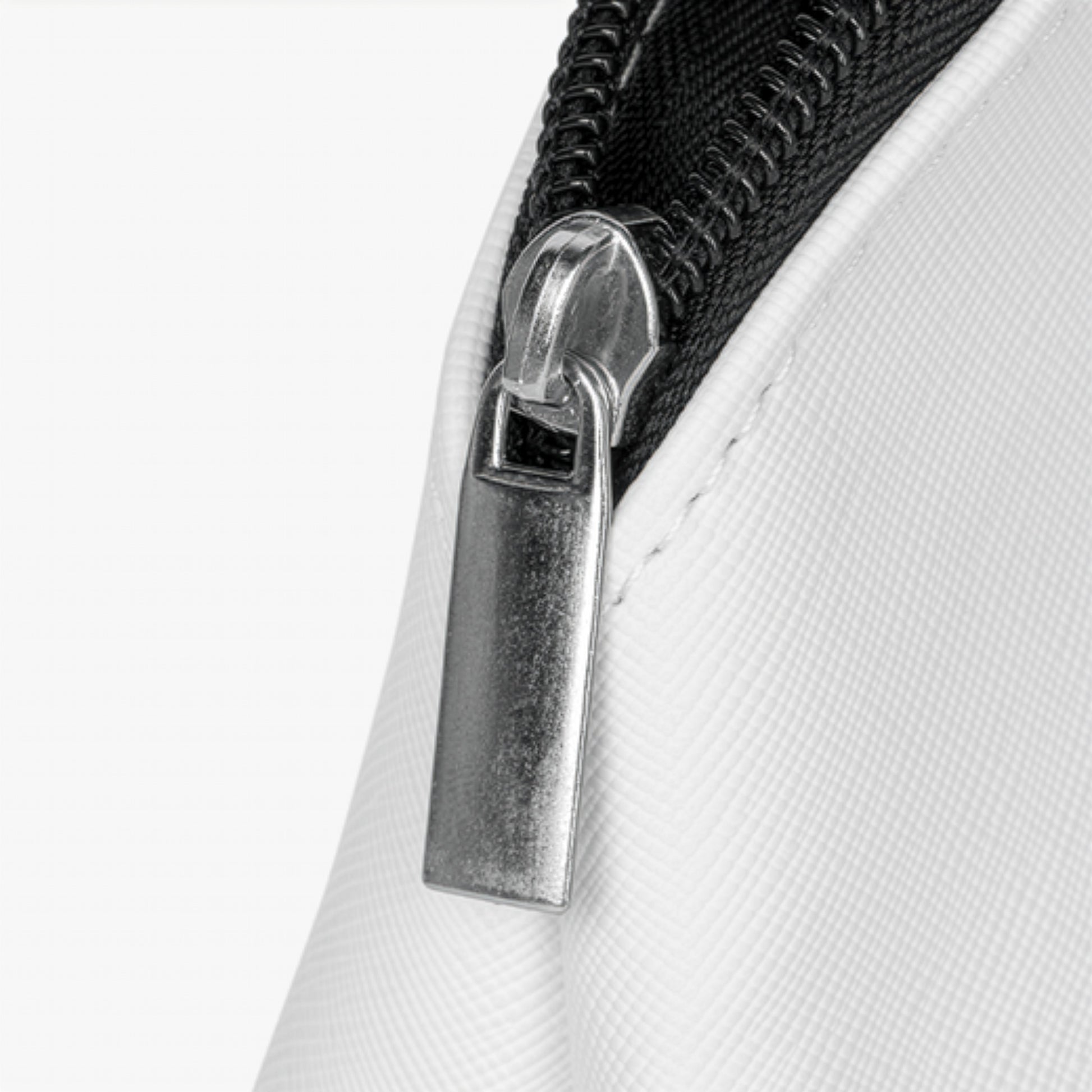 Close-up of a zipper on a white background