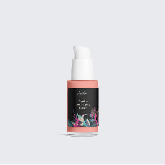 Skincare serum bottle with floral label on a light gray background