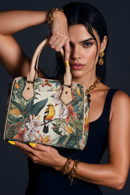Woman holding a floral handbag against a dark background