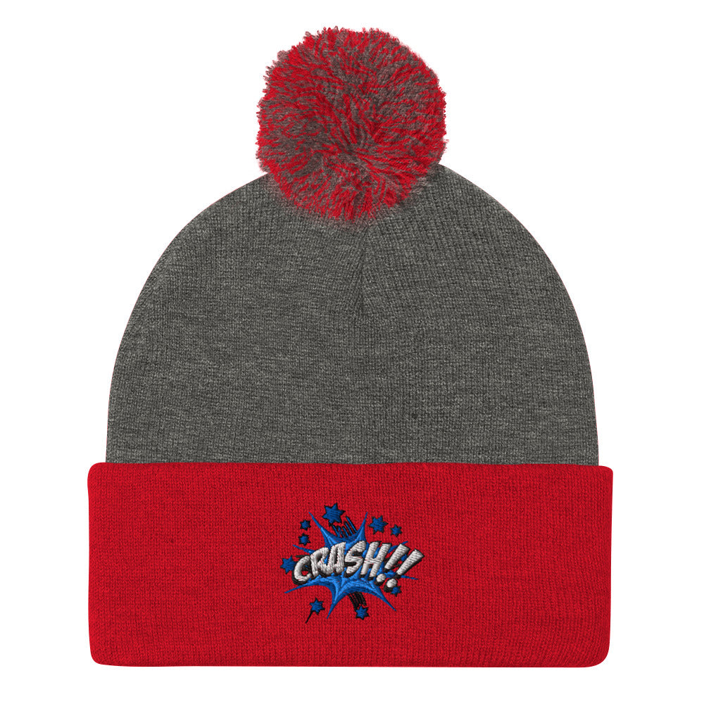  embroidered pom-pom beanie! Featuring a striking "CRASH!!" design